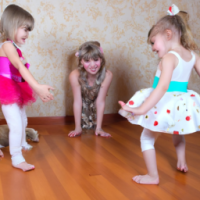 cat dance on the floor and two small girls are happy